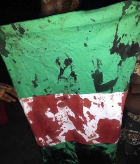 blood stained flag of Nigeria, #endsars protest