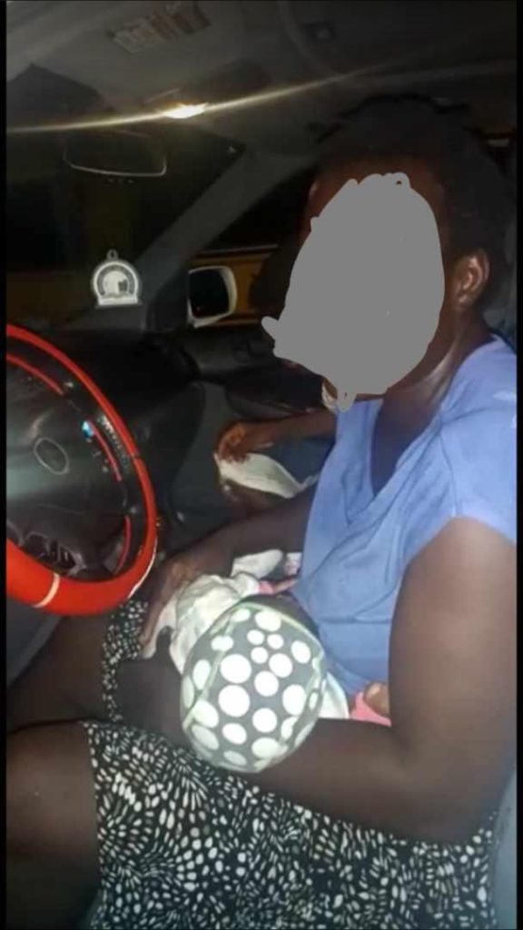 Police officers help woman in Lagos